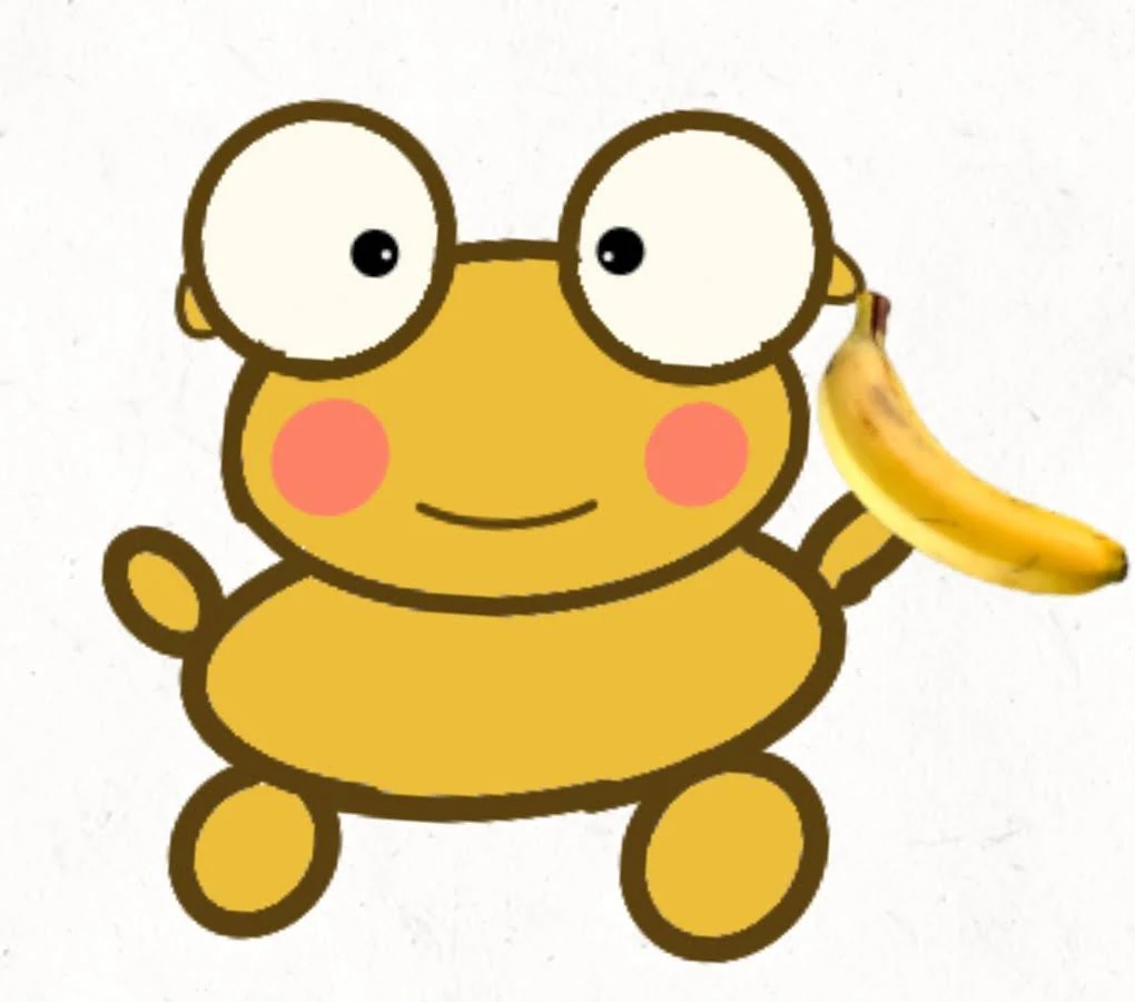 Golden Kero with wide eyes and pink cheeks holds a yellow banana, on a lightly textured white background.
