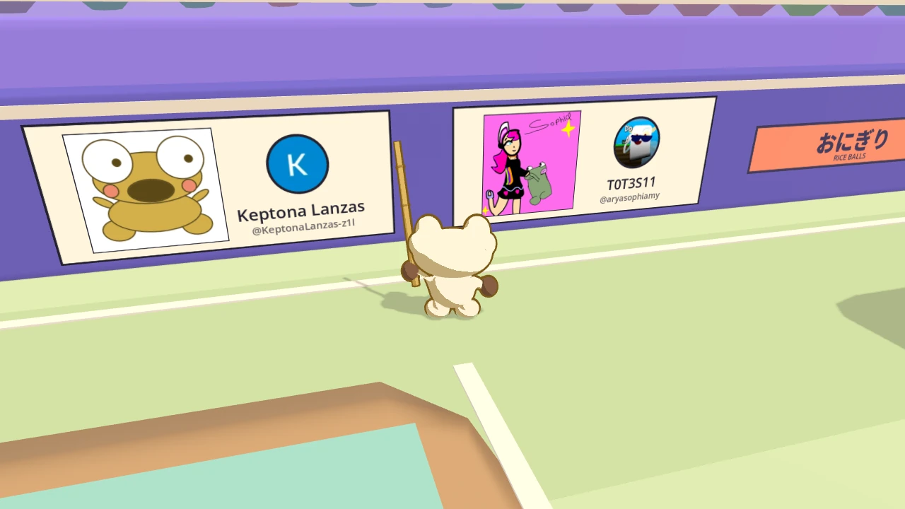 Two panels side by side on the stadium wall, with Kero between them. On the left is Keptona Lanzas’ close up of Kero. On the right is T0T3S11’s drawing of Sophia and a frog. The pitch is green here, one of the looks the stadium changes into.