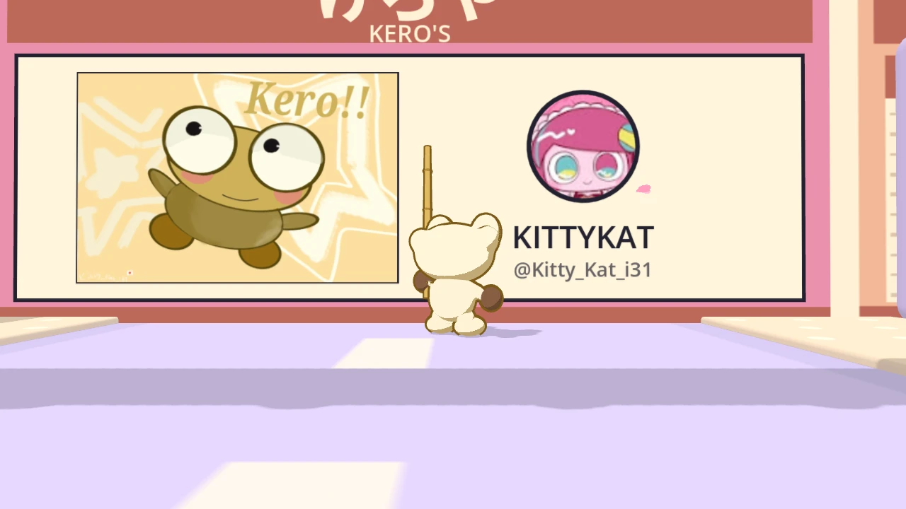 KITTYKAT’s panel on a pink shop wall in Bonk Street, under the KERO’S shop sign. The drawing of a smiling Kero is on the left, and on the right are KITTYKAT’s round picture, the name KITTYKAT and @Kitty_Kat_i31. Kero stands in front of it with his bamboo stick.