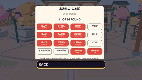 The SHOP WORDS card, with 11 of 16 found. Each found word is a red tab with its English under it, like ぱんや BAKERY and はなや FLOWERS. The rest show only their hiragana, waiting to be found.